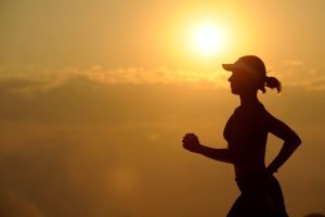 Women smiling and running.